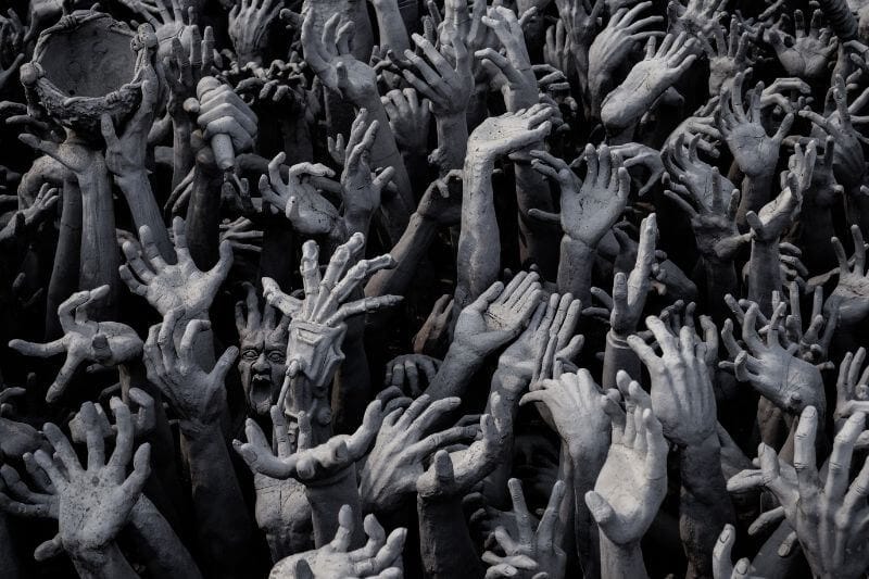 when sin increases showing many hands-on a pit