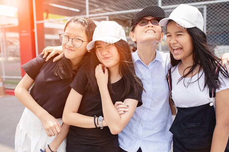 acceptable year showing a group of asian girls and their mother