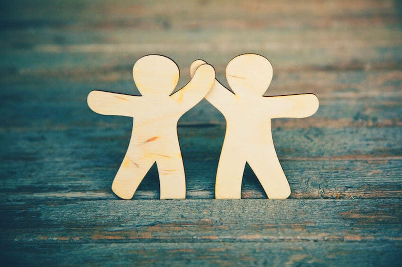 Bible verses about friendship image showing two friends