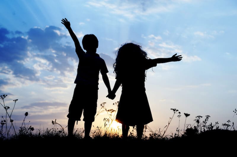 created to fellowship with God showing a young boy and girl holding hands