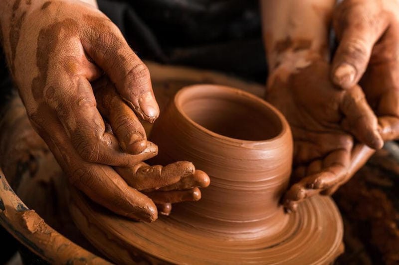 Fearfully made by God image showing a porter molding a clay jar