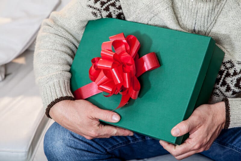 justification by faith showing a man having a gift in his hands