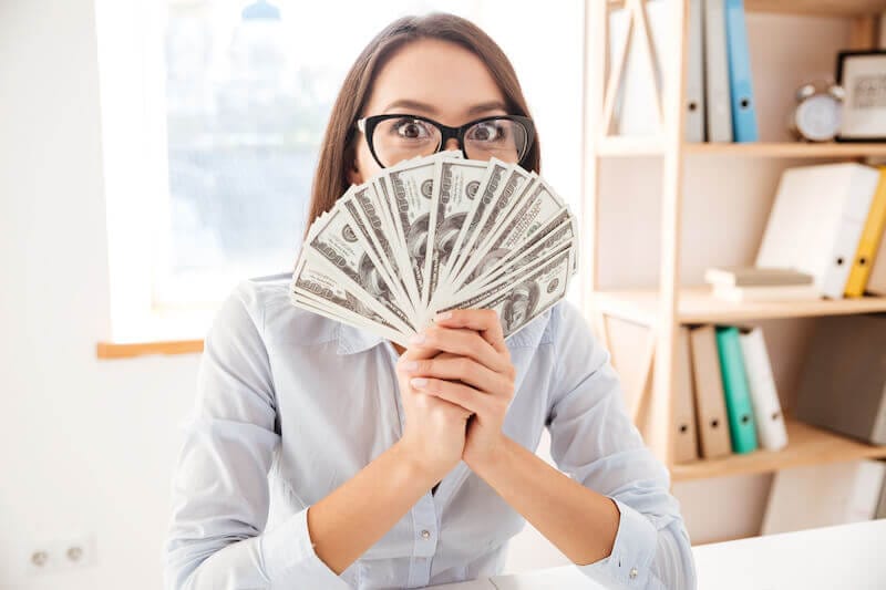 make your way prosperous showing a woman holding money
