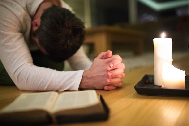 thy prayer is heard showing a man praying