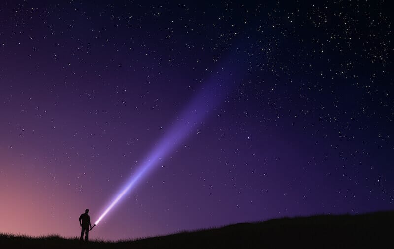 Two laws showing a man with a light