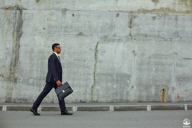 Walking in the Spirit showing a man waking with a briefcase
