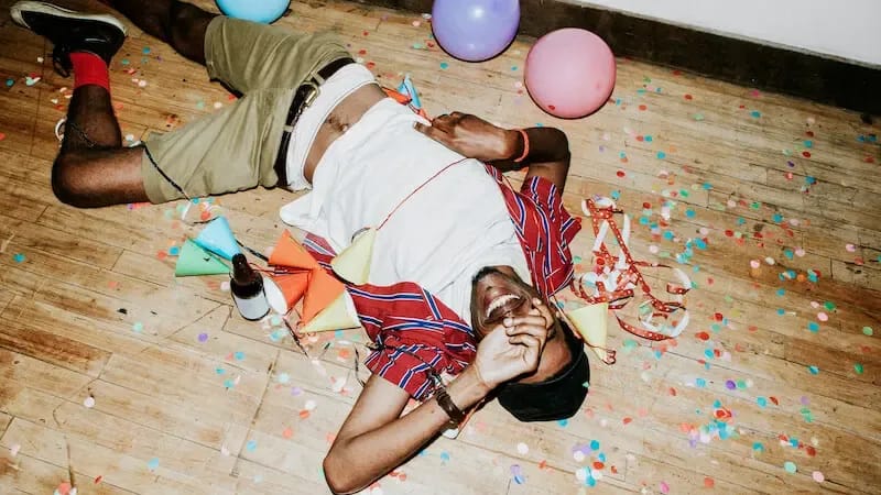 what is carnality showing a man on the floor with a bottle of alcohol