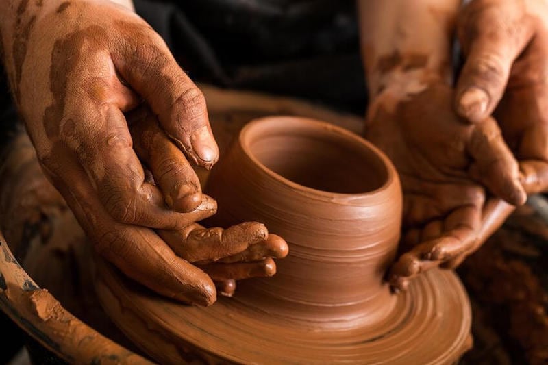 Fearfully made by God image showing a porter molding a clay jar