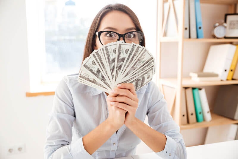 make your way prosperous showing a woman holding money