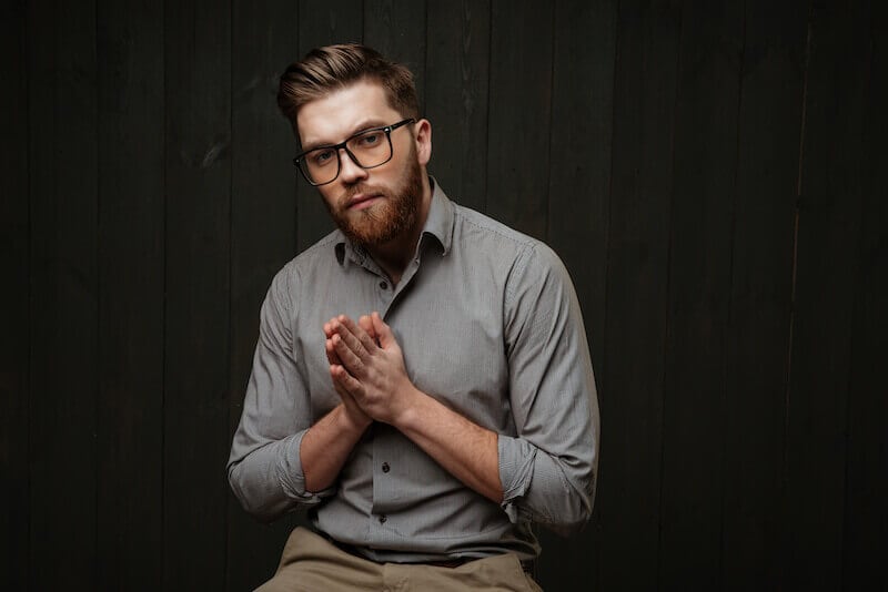 speaking in tongues mysteries showing a man with hands in prayer