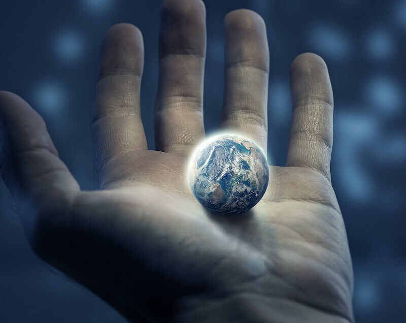 God working showing the earth in a man's hands