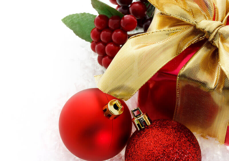 christmas gift with bells indicating God's favor bestowed upon us in Christ