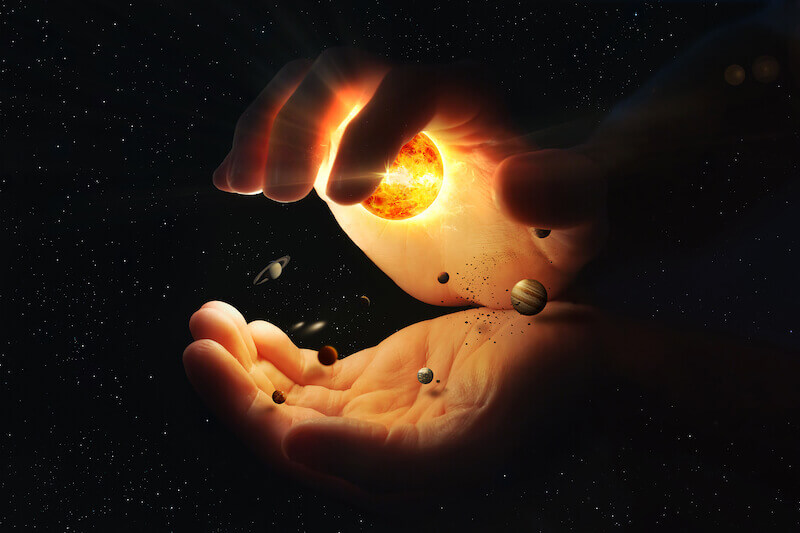 created by God and for God showing a hand holding the universe