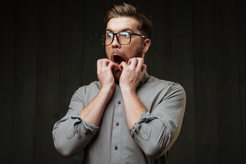 blessings or cursing showing a man with his hands on his mouth