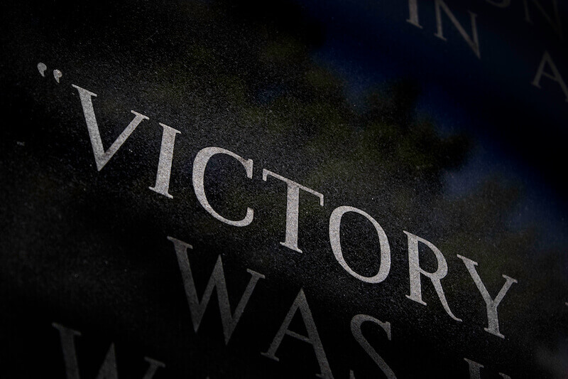 victory showing the letters of the word in a dark background