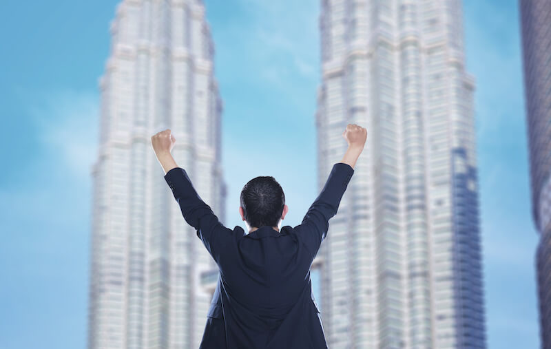 he that is able to do exceedingly abundantly showing a man raising his hands up in triumph