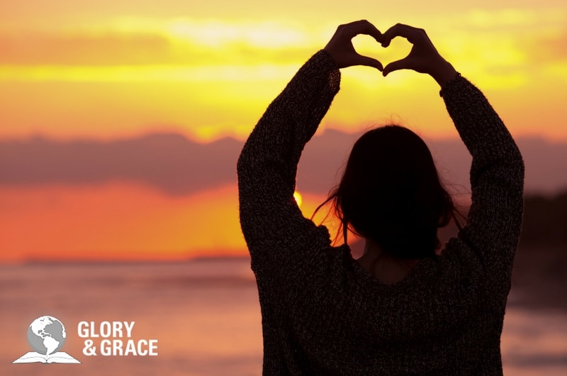 the Spirit's great work in our hearts showing a woman making a heart with her fingers