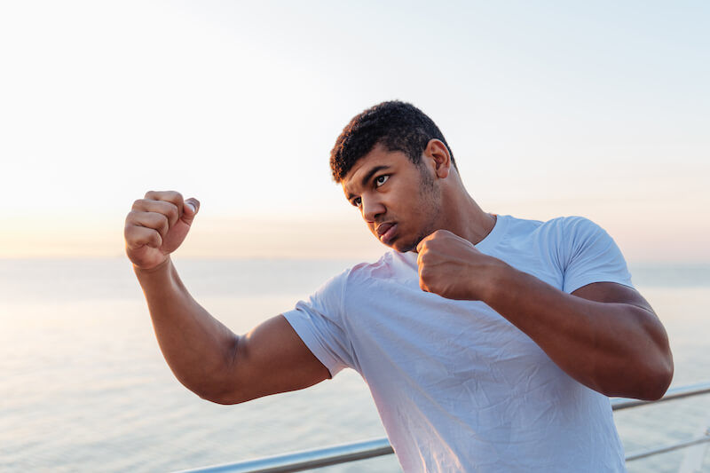i shall not die showing a man with hands ready for a boxing game