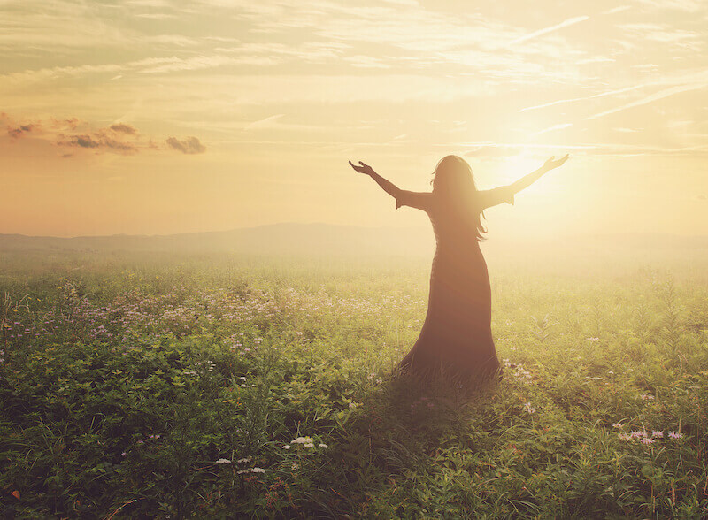 i shall not die but live showing a woman lifting up her hands