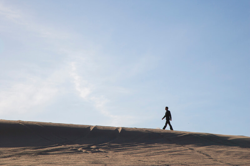 Jesus stood still showing a man walking