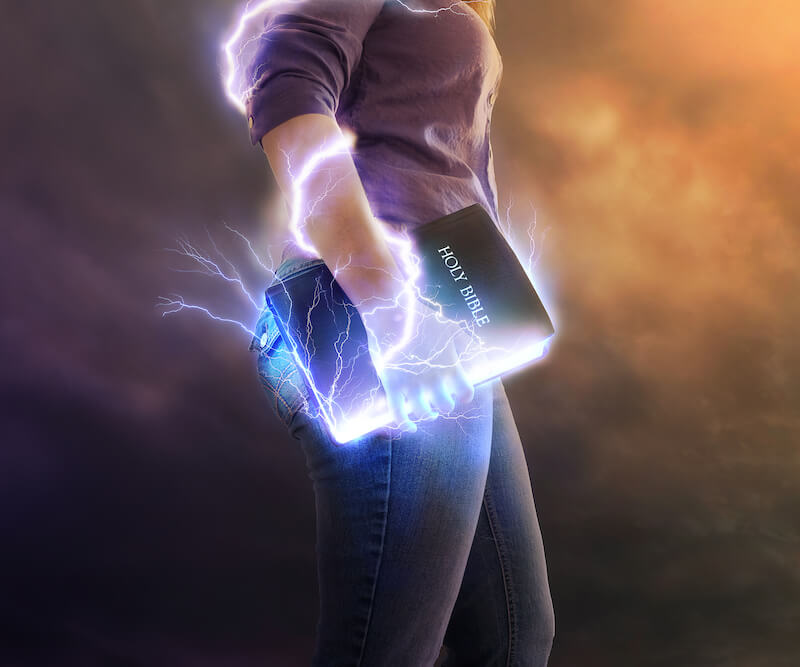 light of men showing a woman with her bible that is releasing lightnings