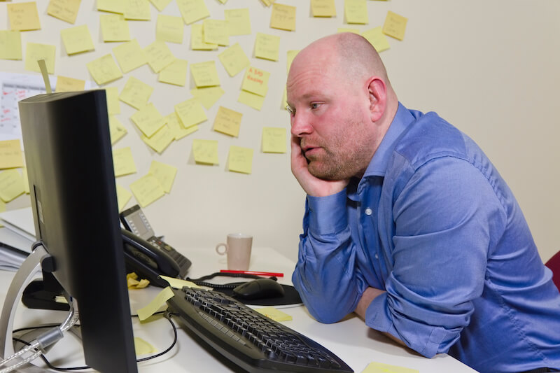 love casts out fear showing a man looking at his computer