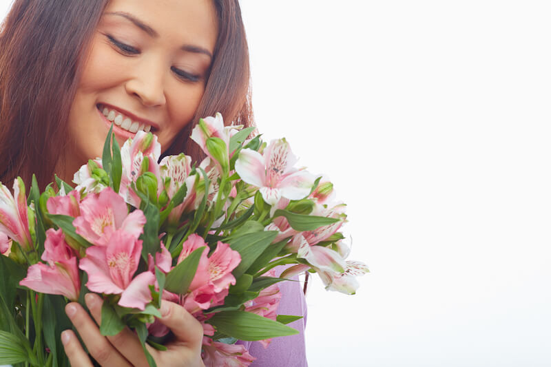 loving Jesus showing a woman holding a bouquet of flowers