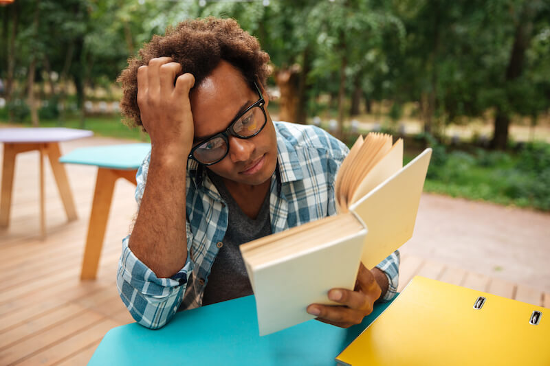 purpose of bible study showing a man reading a book