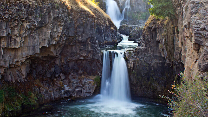 out of your belly shall flow rivers of living water showing a small steam flowing down a rock