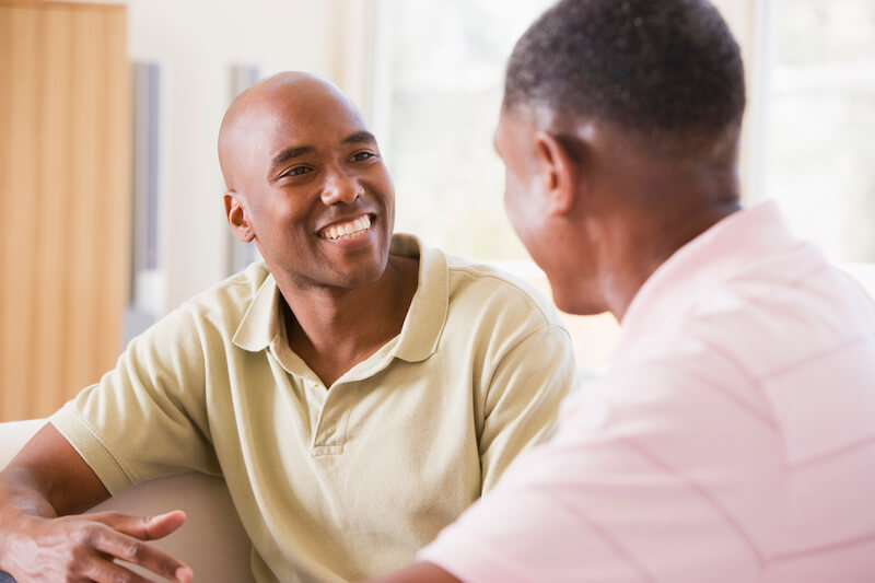 power of words showing two men discussing