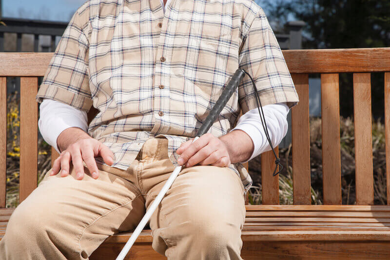 mystery of spiritual blindness showing a blind man outside