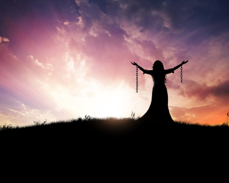 power of God showing a woman with hands free from chains