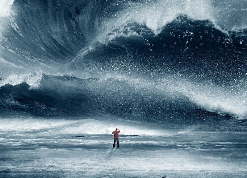 troubled but not distressed showing a man watching the waves of the sea
