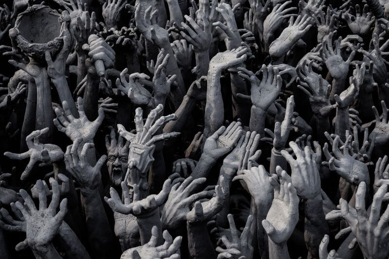 when sin increases showing many hands-on a pit