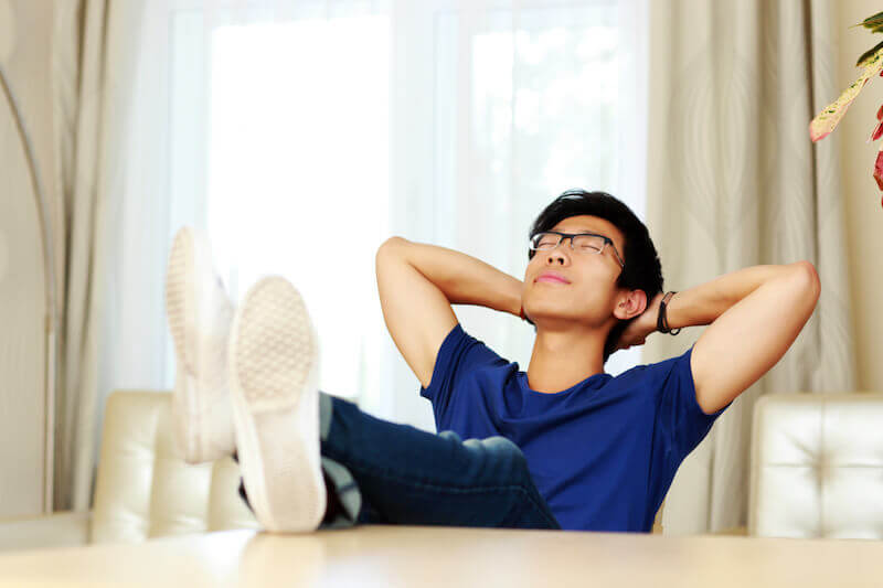 Be still and know that I am God showing a relaxed asian man
