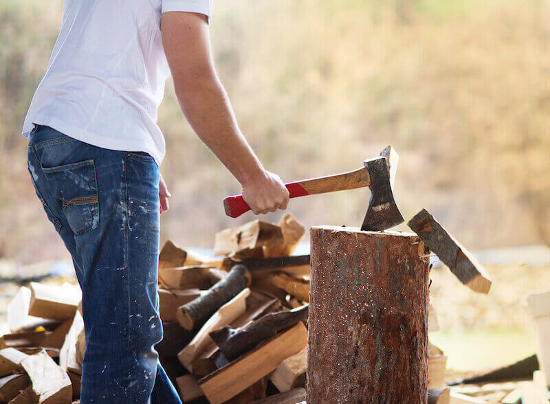 breaking strongholds showing a man splitting wooed