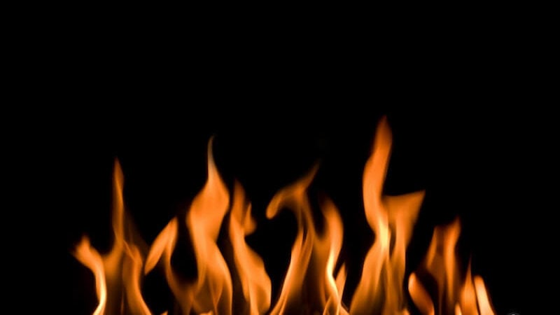 Tongues of fire image showing flames of fire burning in a dark background