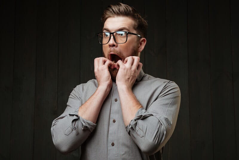 blessings or cursing showing a man with his hands on his mouth