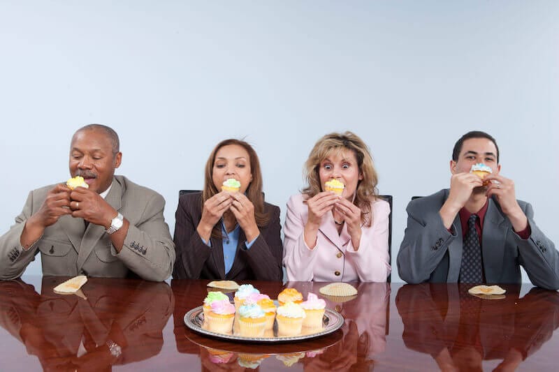 Emotional control showing people eating a lot of food on the table