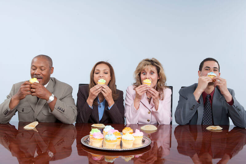 Emotional control showing people eating a lot of food on the table