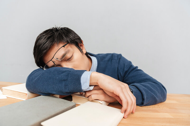 ministry of encouragement showing a man sleeping on his desk