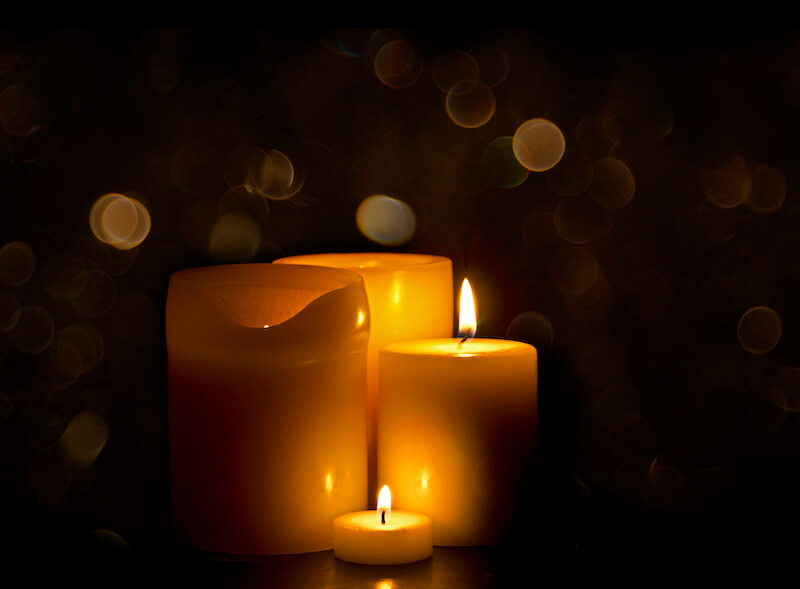glory and graces showing candle lights in the dark