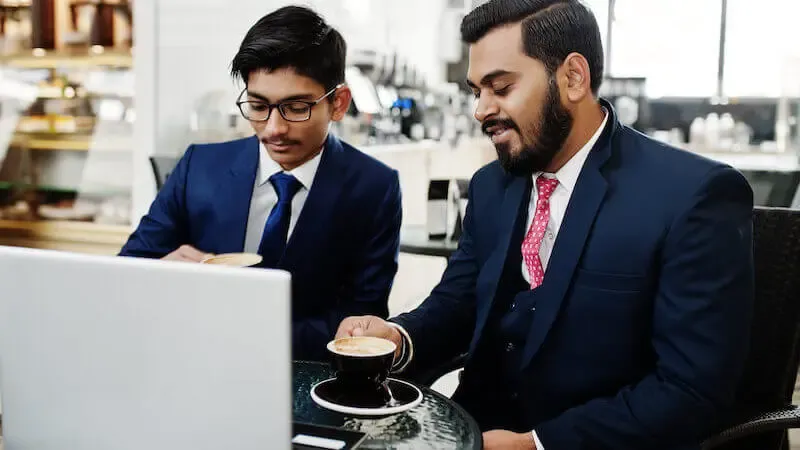 two types of works showing two indian business men