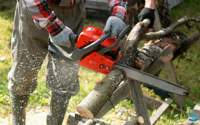 Occupy till I come image showing a man sawing wood with a chain saw