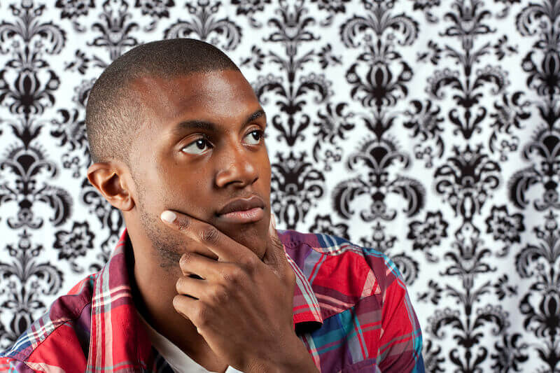 how to provoke inspiration showing a young black man thinking