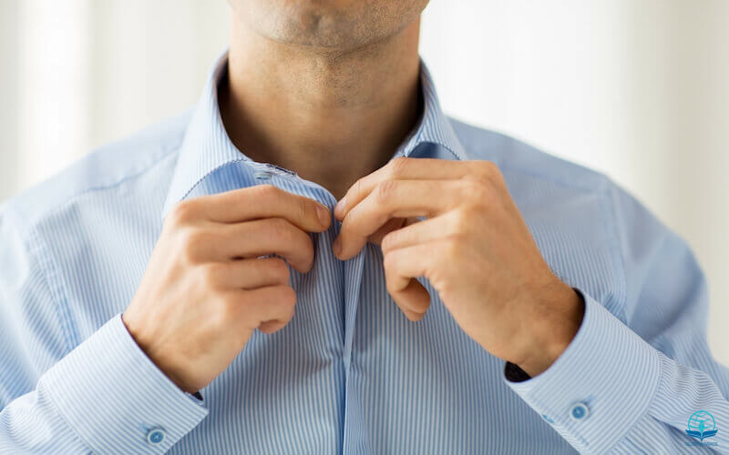 Put on the new man showing a man putting on his shirt