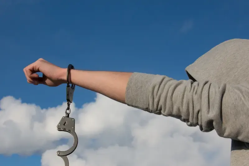 redemption showing a man with handcuffs from his hands