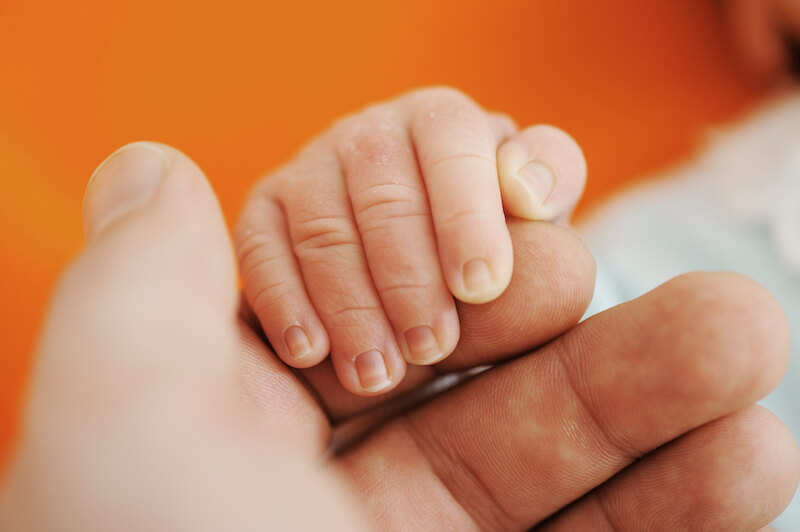 time appointed by the Father showing a baby's hands