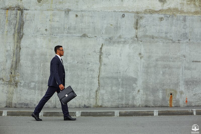 Walking in the Spirit showing a man waking with a briefcase