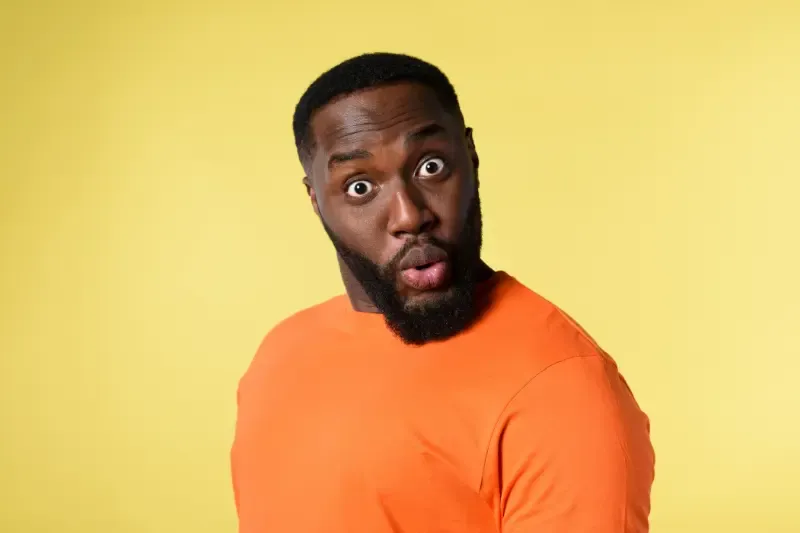Revelation showing a surprised black man